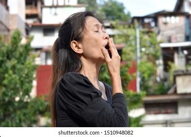 Older Asian Granny Yawning Stock Photo Edit Now