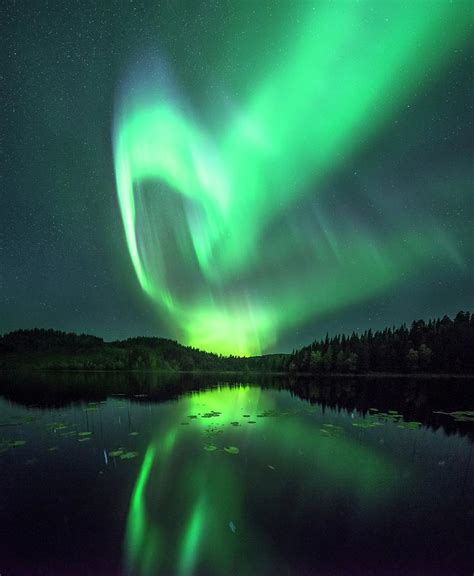 Aurora Borealis Over A Lake Photograph By Tommy Eliassenscience Photo