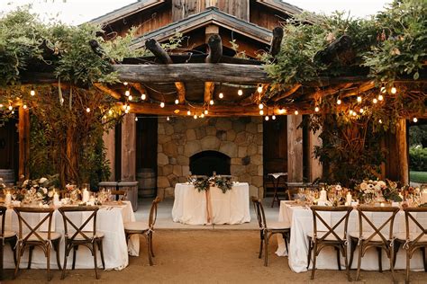 An Outdoor Dining Area With Tables And Chairs Set Up For A Formal