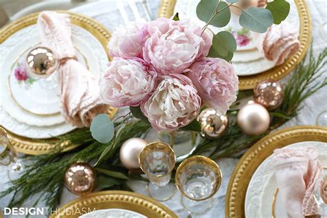 Elegant Holiday Table Setting with Gold and Pink Christmas Decorations