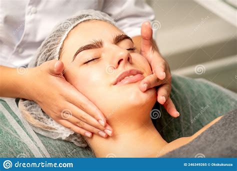 Face Massage Beautiful Caucasian Young White Woman Having A Facial Massage With Closed Eyes In