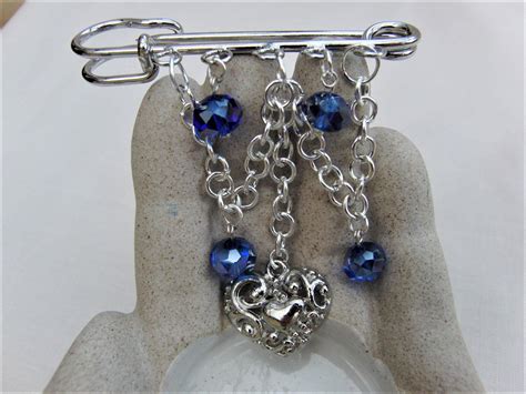 This Pretty Blue Crystal And Silver Chain Kilt Pin Brooch Is Available