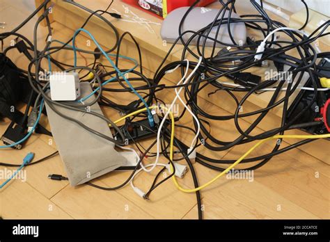 Mess Of Electronic Charging Equipment And Cables Stock Photo Alamy