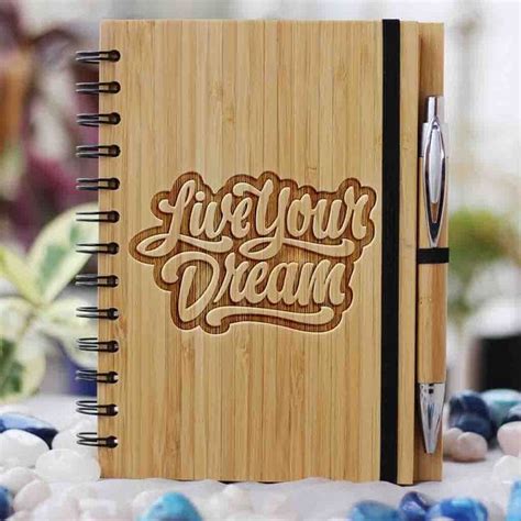 A Wooden Notebook With The Words Live Your Dream Written On It