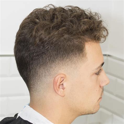 A taper fade haircut features hair that gradually changes from long to short, with a fade down the skin. White Boy Taper Fade