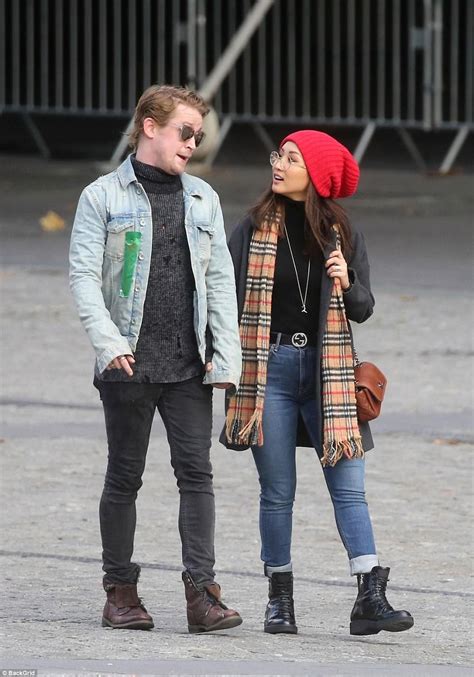 So what on earth is he doing here? Macaulay Culkin and Brenda Song enjoy break in Paris ...