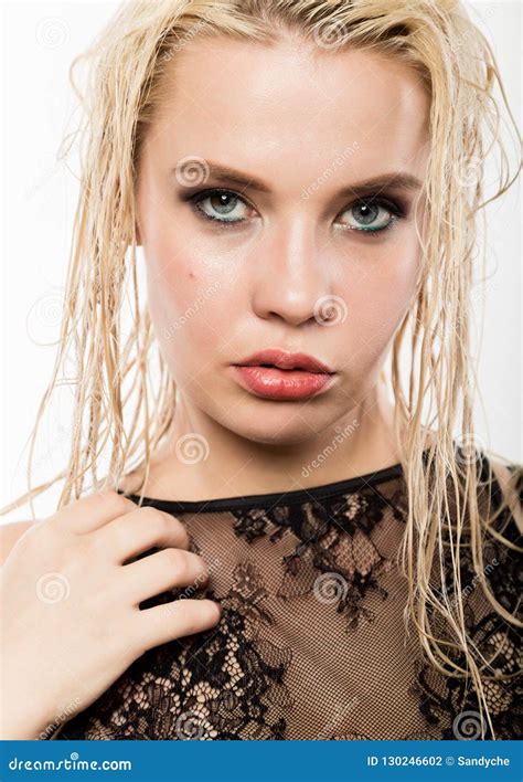 Glamor Beautiful Blonde Girl With Wet Hair And Skin Bright Makeup And Plump Lips With A Damp