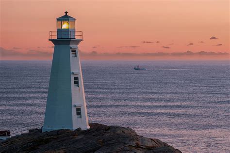 Cape Spear Lighthouse And Boat Photograph By Ryan Desjardins