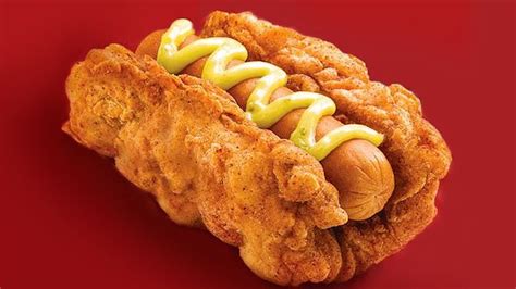 It's a hot dog, wrapped in chicken.covered in cheese. KFC's Double Down hot dog is a sausage wrapped in a fried ...