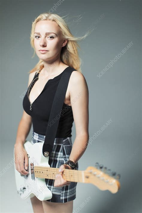 Portrait Cool Young Woman Playing Electric Guitar Stock Image F023