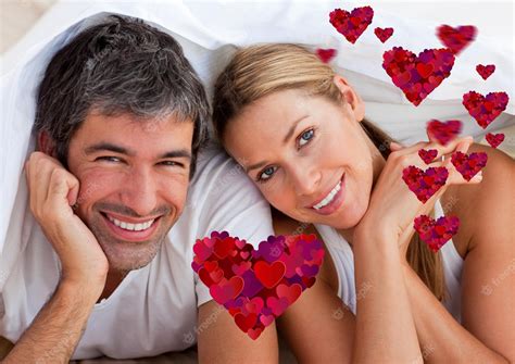 Premium Photo Portrait Of Happy Couple Lying On Bed At Home