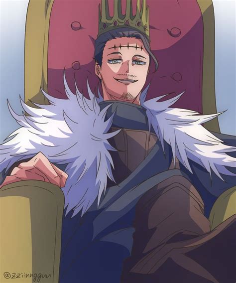 A Man Sitting In A Chair With A Crown On His Head And White Feathers Around His Neck