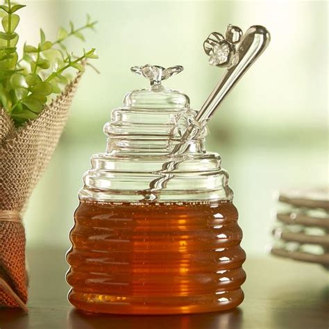 Crafted From Glass With The Distinctive Rings Of A Classic Beehive This Honey Pot Includes A