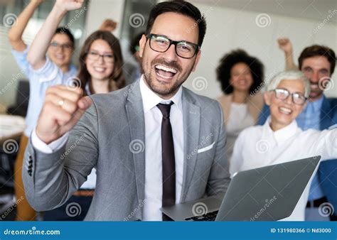 Happy Business People Celebrating Success At Company Stock Photo