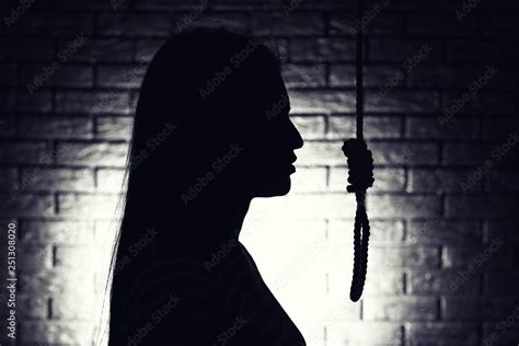 Silhouette Of Woman With Noose On Dark Background Suicide Concept Stock Photo Adobe Stock