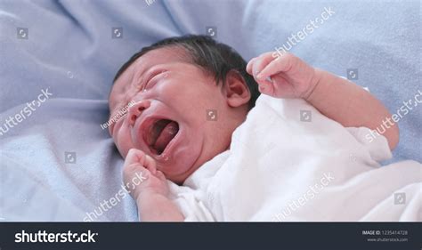 New Born Baby Crying On Bed Stock Photo 1235414728 Shutterstock