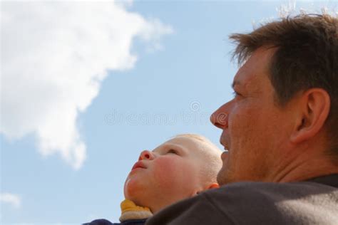 Father And Son Are Looking At The Sky Stock Photo Image Of Happy