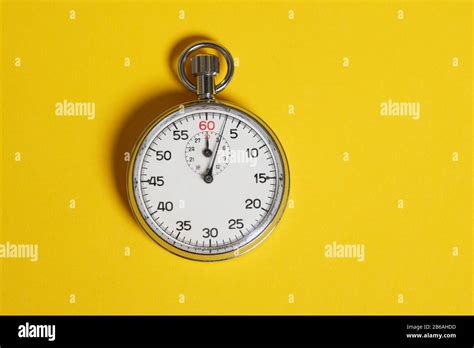 Classic Stopwatch On A Yellow Background Stock Photo Alamy