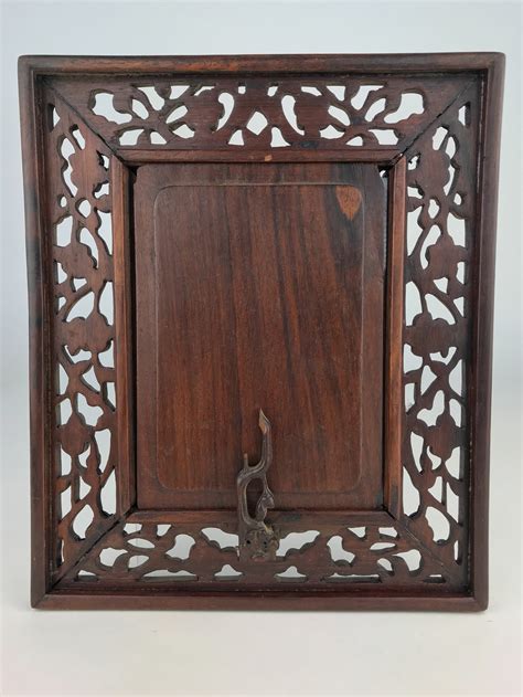 Chinese Carved Wood Picture Frame with Doors | Witherell's Auction House