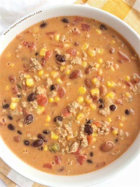 Add tomato paste, rotel tomatoes, condensed soup, and velveeta cheese, and cheddar cheese. Easy Cheesy Taco Soup - Together as Family