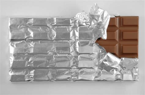 Partially Unwrapped Bar Of Chocolate Stock Photo Download Image Now