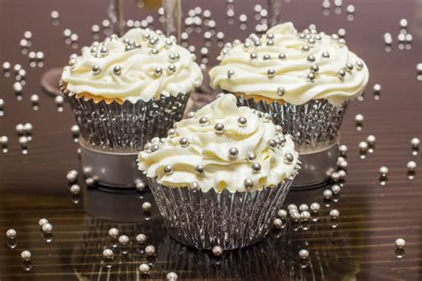 White Cupcakes With Silver Decorative Sprinkles Stock Photo Image