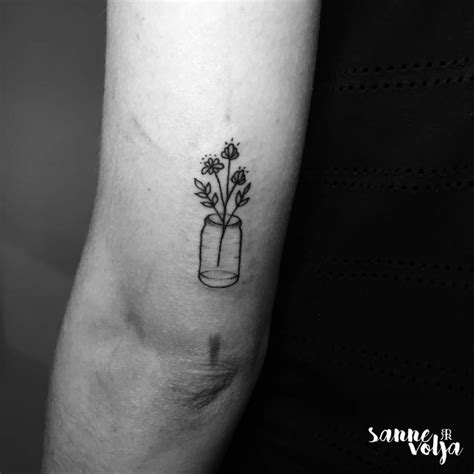 Wild Flowers In A Bottle Tattoo On The Tricep
