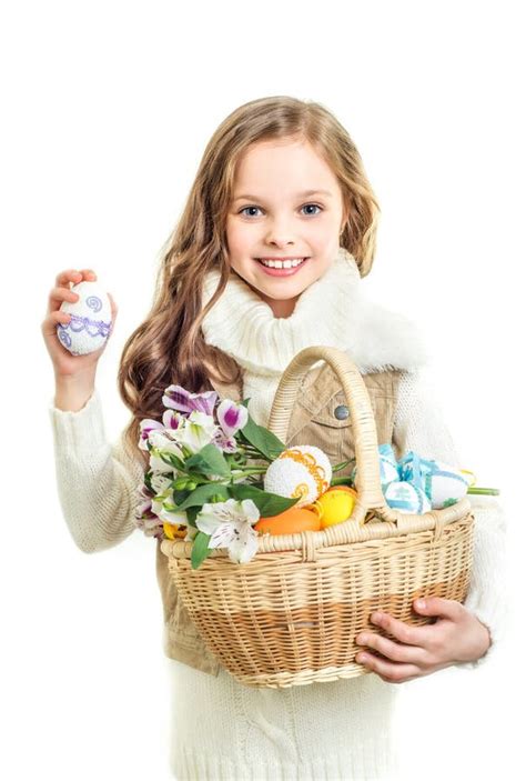 Smiling Little Girl With Basket Full Of Colorful Easter Eggs Stock