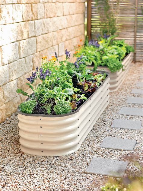 a stylish step up from popular galvanized trough planters this eye catching raised bed is made