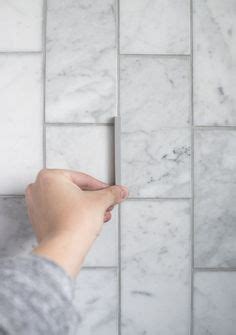 You can also use acids but you run the risk of etching the surface of gently scrub the grout in between the marble tiles with the toothbrush in a back and forth motion. Grout color for Carrara Marble Tile? in 2019 | Marble subway tiles, Marble tile bathroom, Marble ...