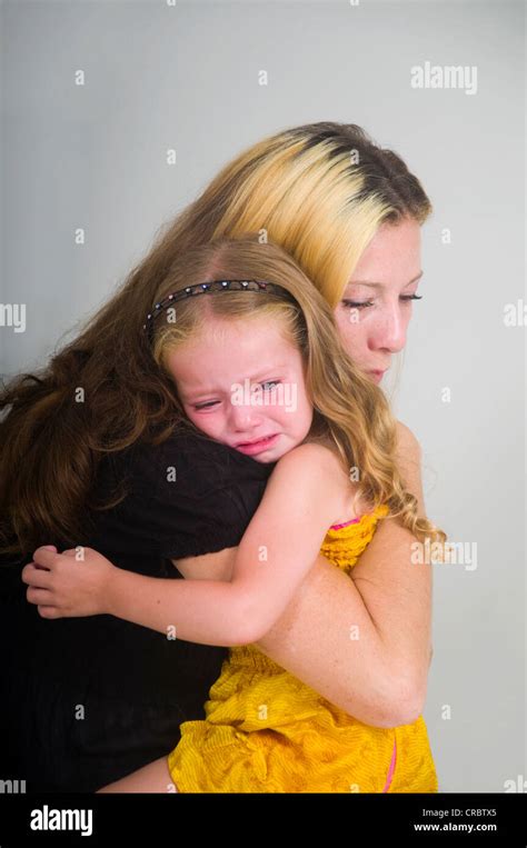 Mother Comforting Crying Girl Stock Photo Alamy