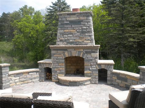 Artesian Blend Natural Stone Outdoor Fireplace With Curved Sitting