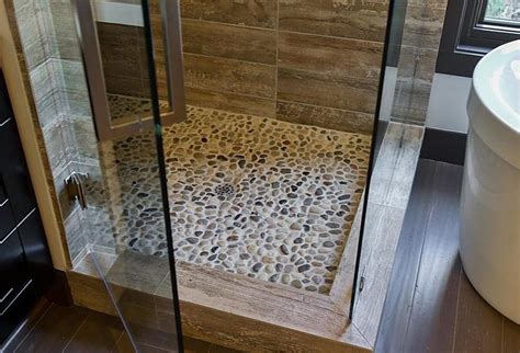 Create A Sanctuary In Your Bathroom With Pebble Tile Pebble Tile Stone Shower Floor Stone Shower