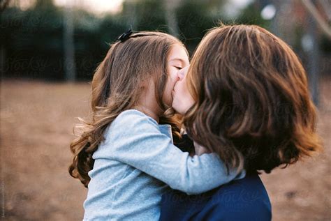 Mother And Daughter Kissing By Stocksy Contributor Jakob Lagerstedt