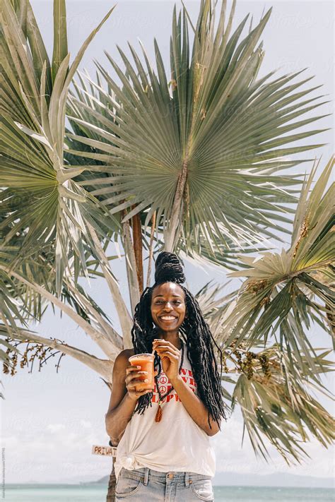Portrait Of A Beautiful African American Woman At The Beach Del Colaborador De Stocksy Andrey
