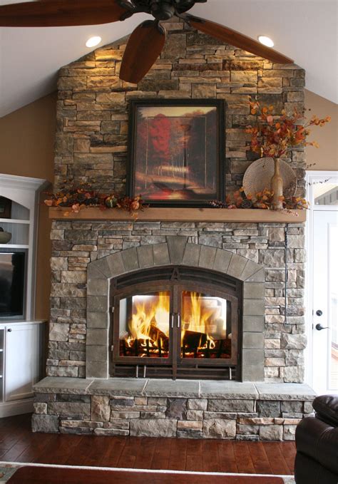 Floor To Ceiling Stone Fireplace With Full Width Wood Mantel Home
