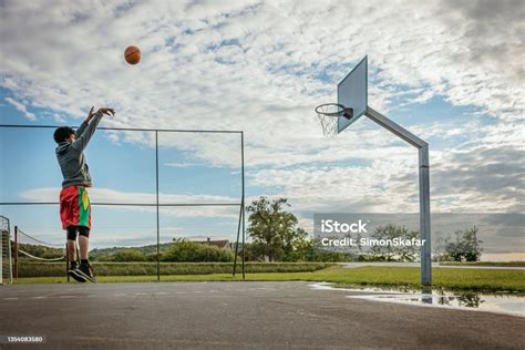 Basketball Player Practicing Free Throws Stock Photo Download Image