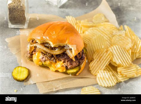 Homemade Juicy Lucy Cheeseburger With Cheddar And Chips Stock Photo Alamy