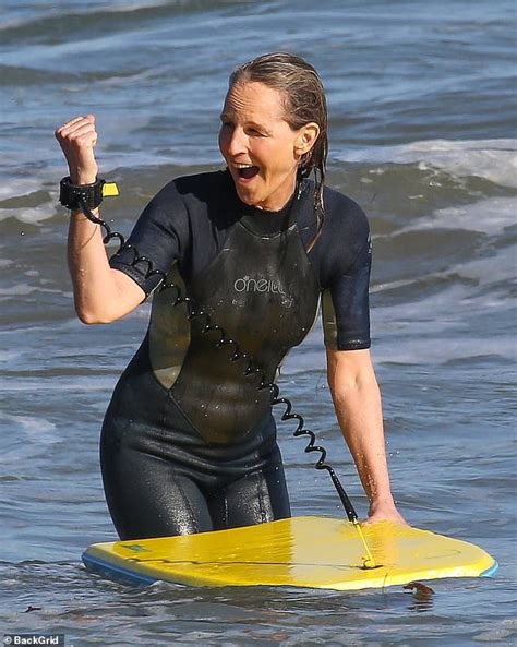 Helen Hunt Rocks A Wet Suit To Catch Some Waves During Morning