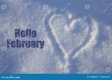 Hello February Greeting Card With Heart Drawing On Natural White Snow