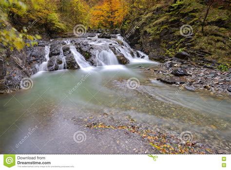 Beautiful Waterfall In Forest Autumn Landscape With Lots Of Red Stock