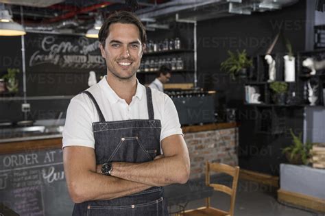 Portrait Of Happy Restaurateur Stock Photo