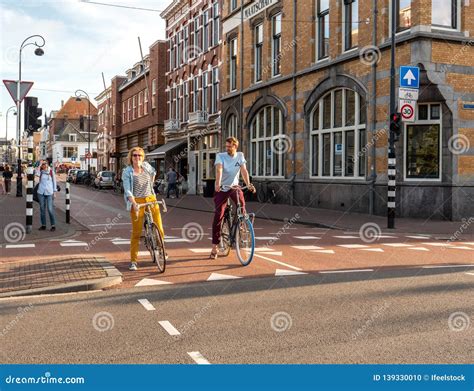 dutch couple on bicycle smiling happy commuting editorial image 139330010