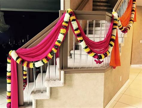 Home Décor for an Indian Wedding home. Drapes and flowers by Dress up