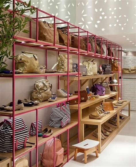 The Inside Of A Womens Shoe Store With Shelves Filled With Purses And