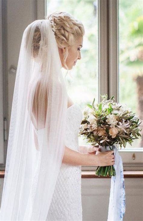 This braided style will be the crowning glory of your whole wedding day look. 15 Classic Wedding Hairstyles that Work Well with Veils ...