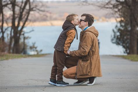 Father Hugging Little Son Outdoors Stock Photo Image Of Park Sweet