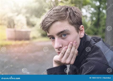 Young Man Who Is Resting His Head On His Hand Stock Image Image Of