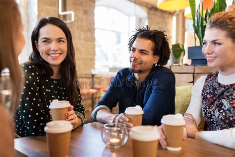 Happy Friends Drinking Coffee At Restaurant Stock Photo Image Of