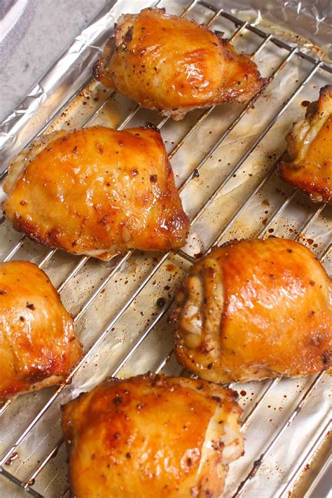 Bake chicken in the preheated oven until no longer pink at the bone and the juices run clear, about 30 minutes. Oven Baked Chicken Thighs {Easy & Crispy!} - TipBuzz